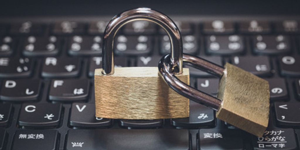 cybersecurity concept with padlock on computer keyboard