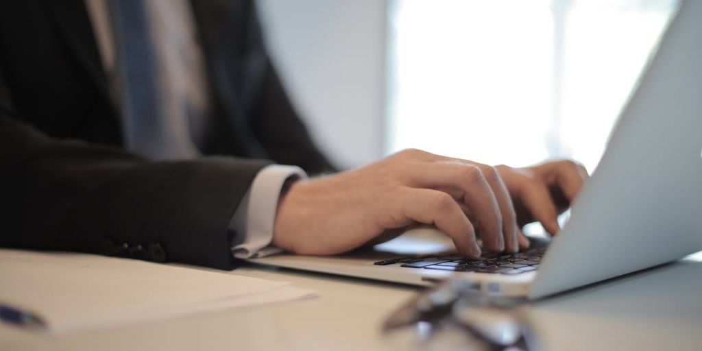 person using laptop with VPN shield icon, digital security, online privacy