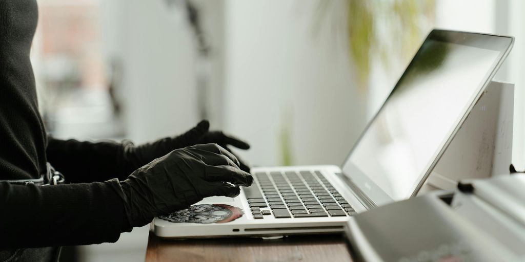 person using a MacBook with VPN interface, secure internet connection, digital privacy