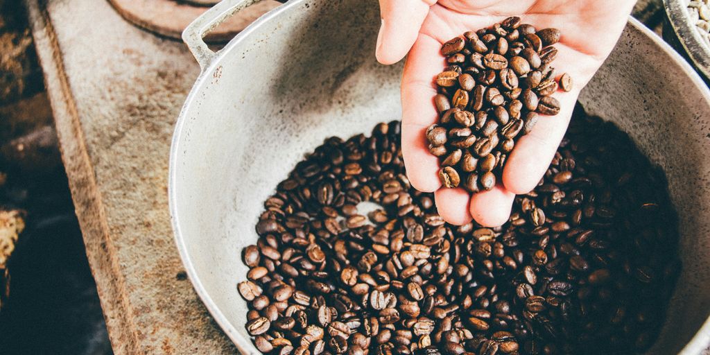 coffee beans on gray steel wok